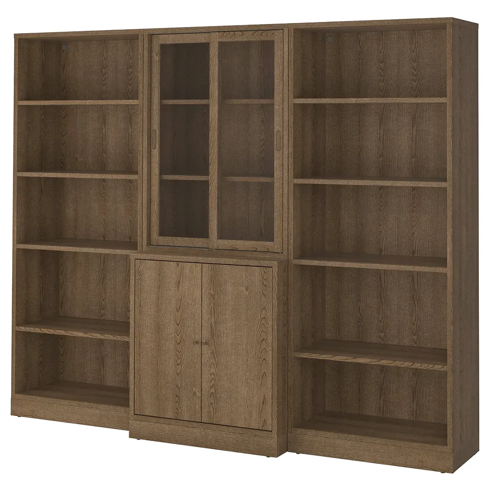 Large wooden bookshelf with a mix of open and closed sections. Multiple shelves and cabinets, made of oak veneer. Classic, organised design.