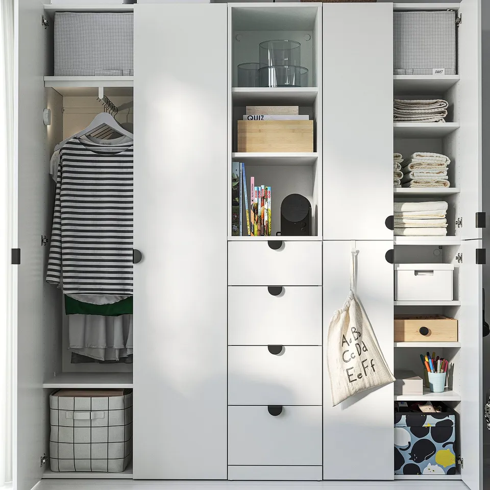 A well-organized closet with hanging clothes, shelves with storage boxes, books, and kitchenware. Adjustable feet ensure stability.