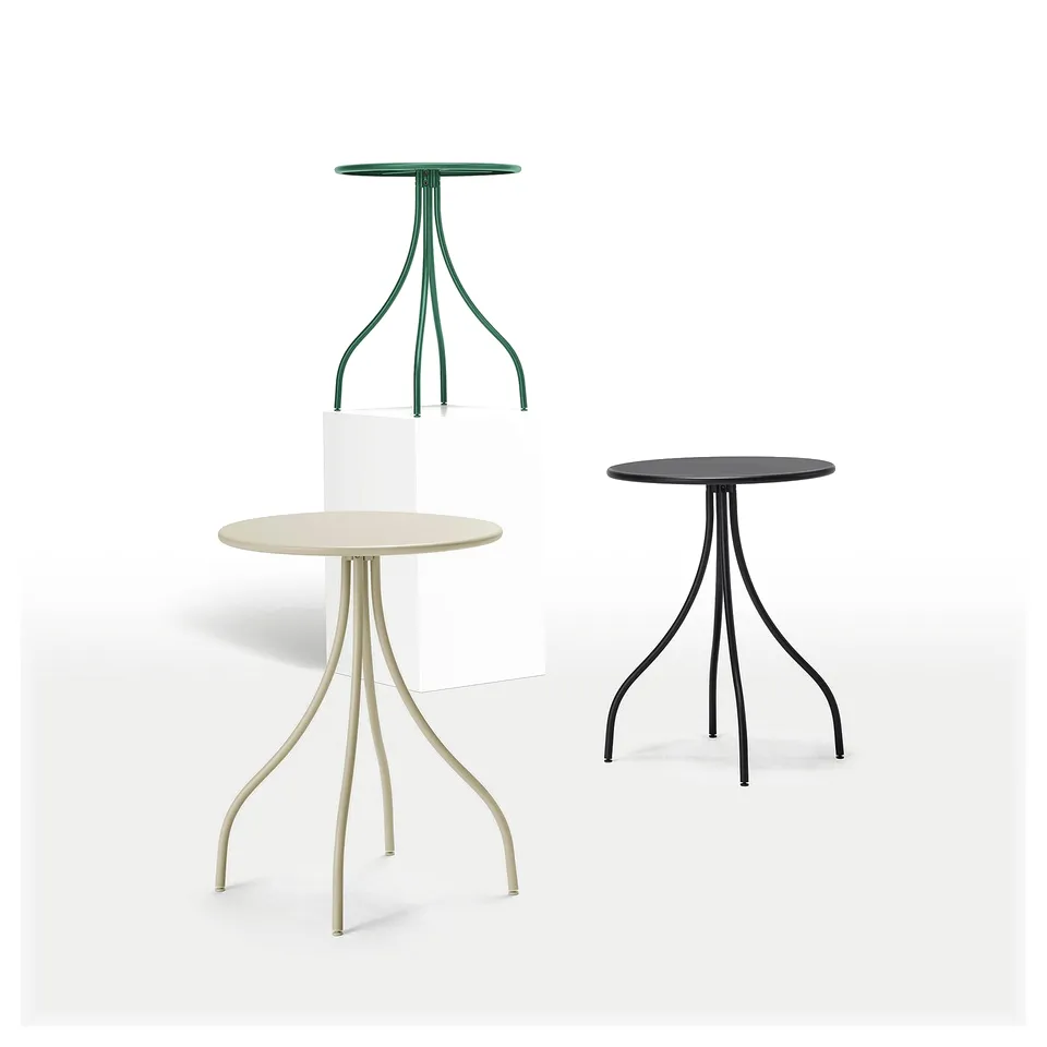 Three modern, round tables with unique, stylized legs in various colours and materials.