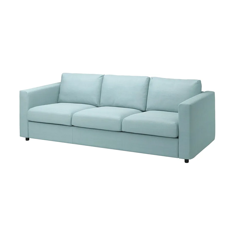 A VIMLE sofa in light blue, a modern design made from fabric and foam. It has three cushions and a minimalist yet comfortable look.