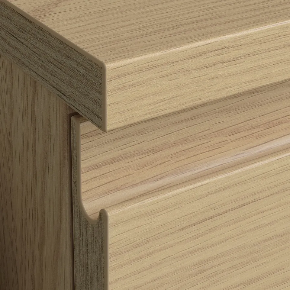 Close-up of well-crafted wooden furniture, showcasing smooth, light wood grain and sleek, integrated handle design.