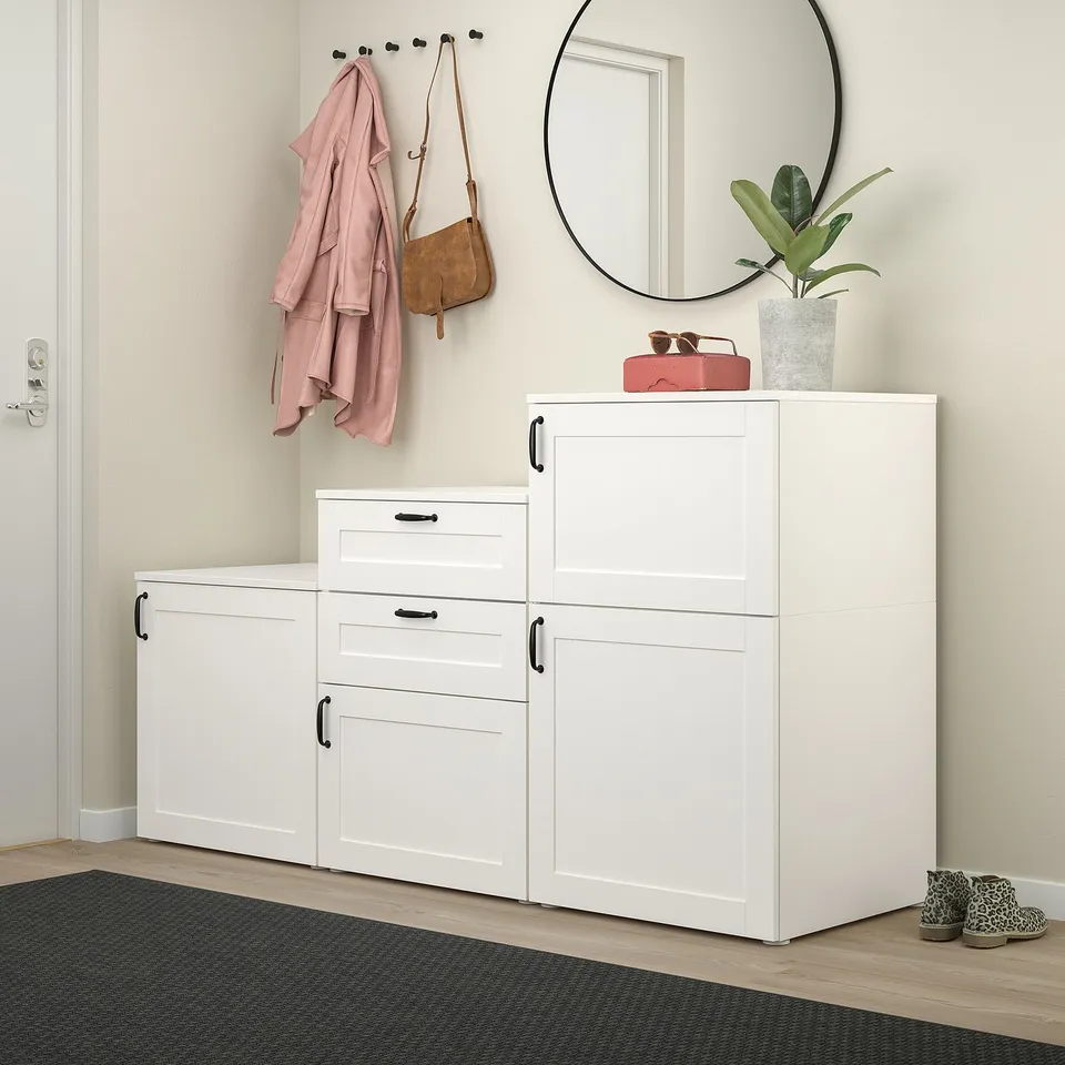 Modern entryway with PLATSA storage, mirror, plant, and accessories.