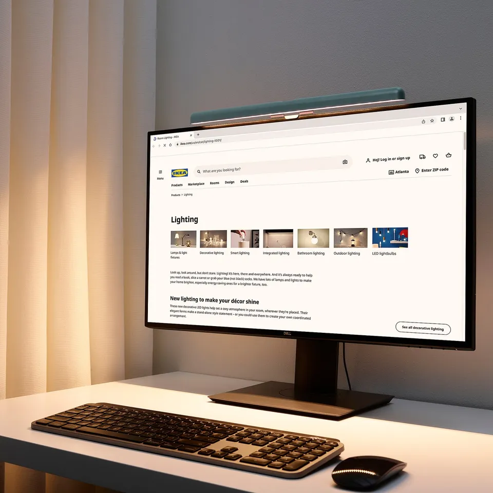 Computer desk with LAGERGÅNG lamp, keyboard, mouse, laptop, and window.