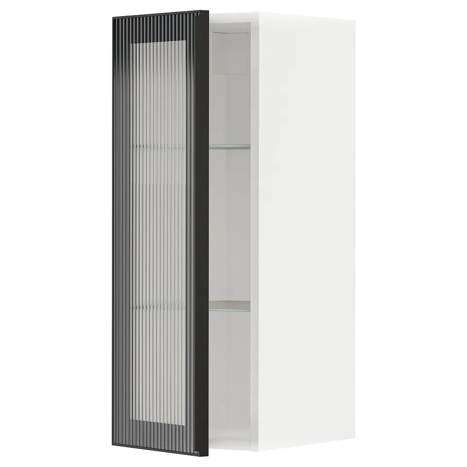 White METOD kitchen cabinet with black, reeded glass door.