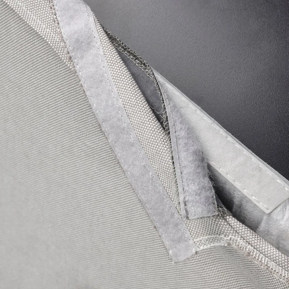 Image shows a light grey, washable cover for a BERGMUND chair, designed with a soft, removable fabric.