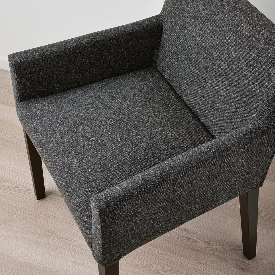 Dark grey upholstered chair with modern style, sturdy wooden legs, cushioned for comfort.