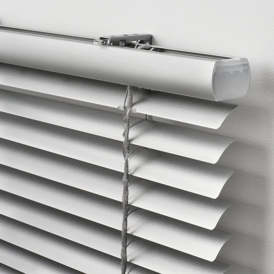 Modern, minimalist window blinds with clean lines, cord-free design for safety, and adjustable slats for light control.