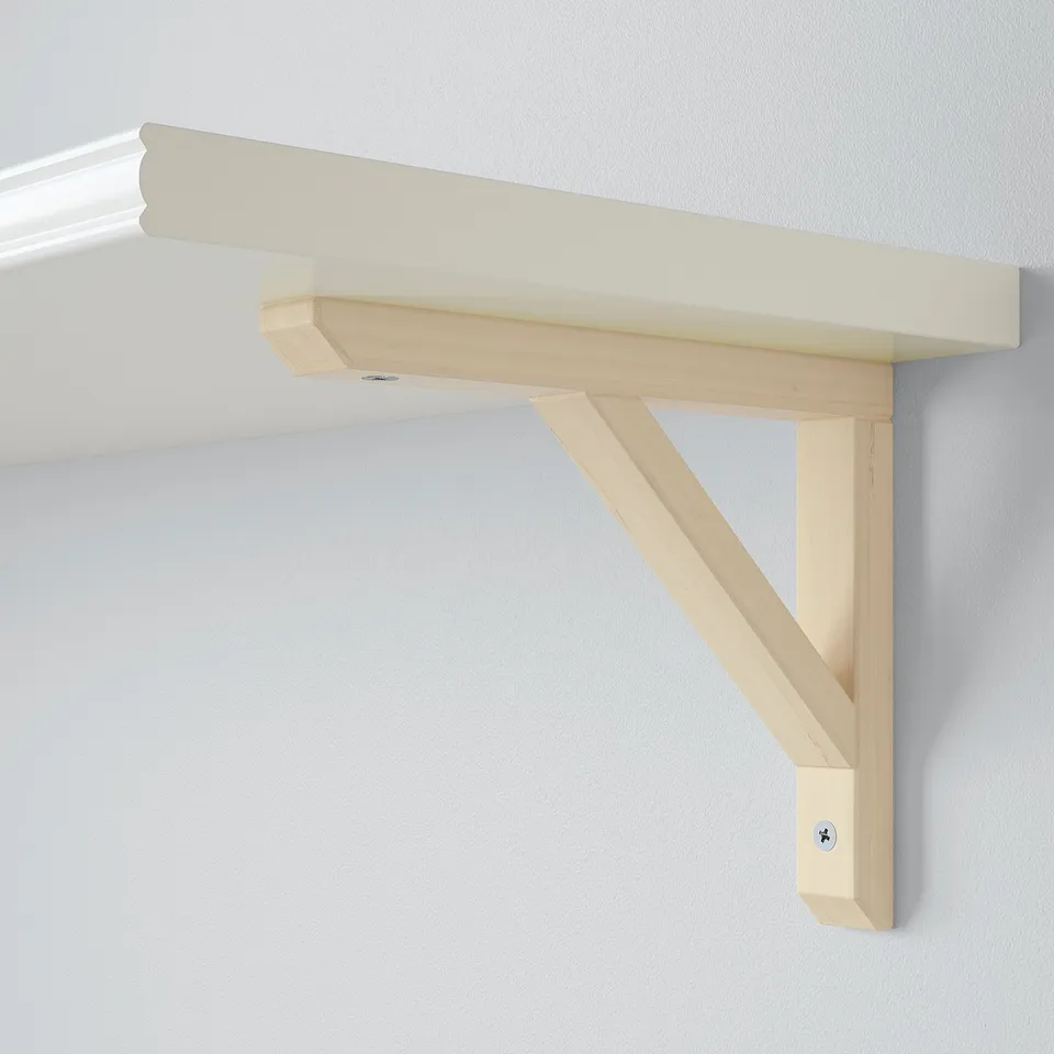 Minimalist wall shelf, light wood, angled support, simple elegant design.