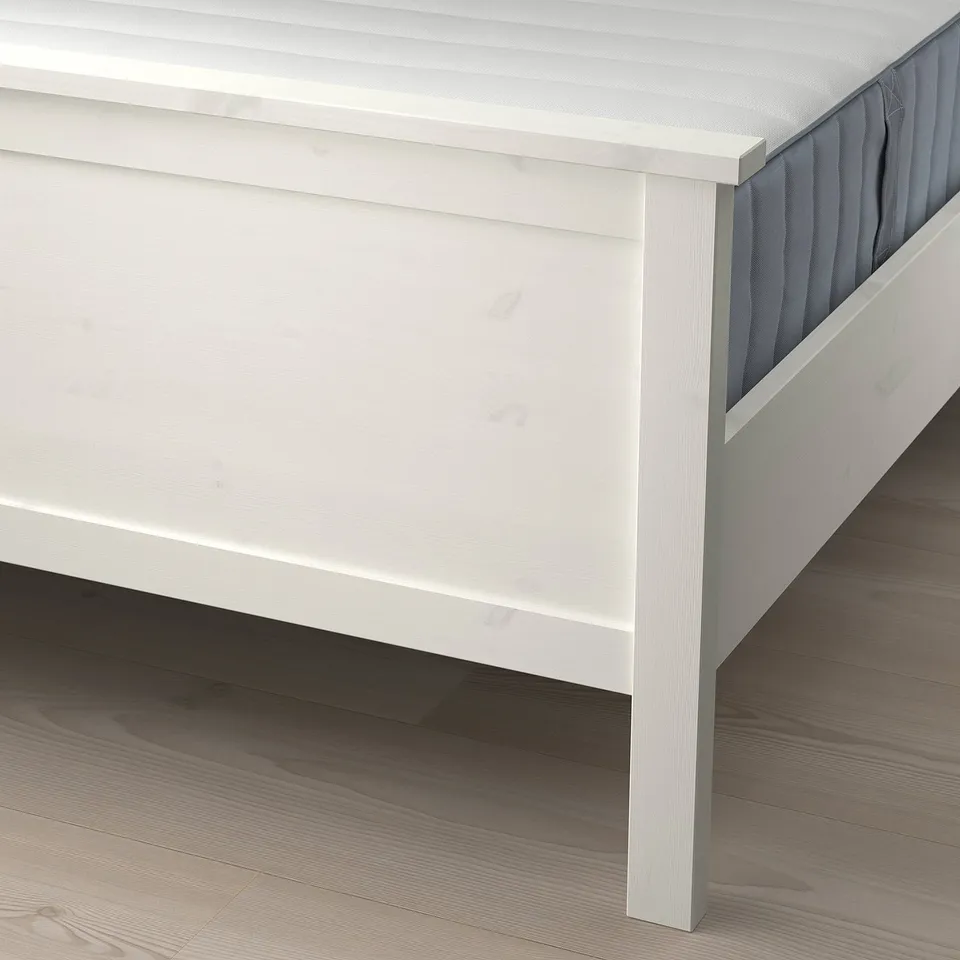 Bed frame with slatted base. Supports mattress and provides under-bed storage.