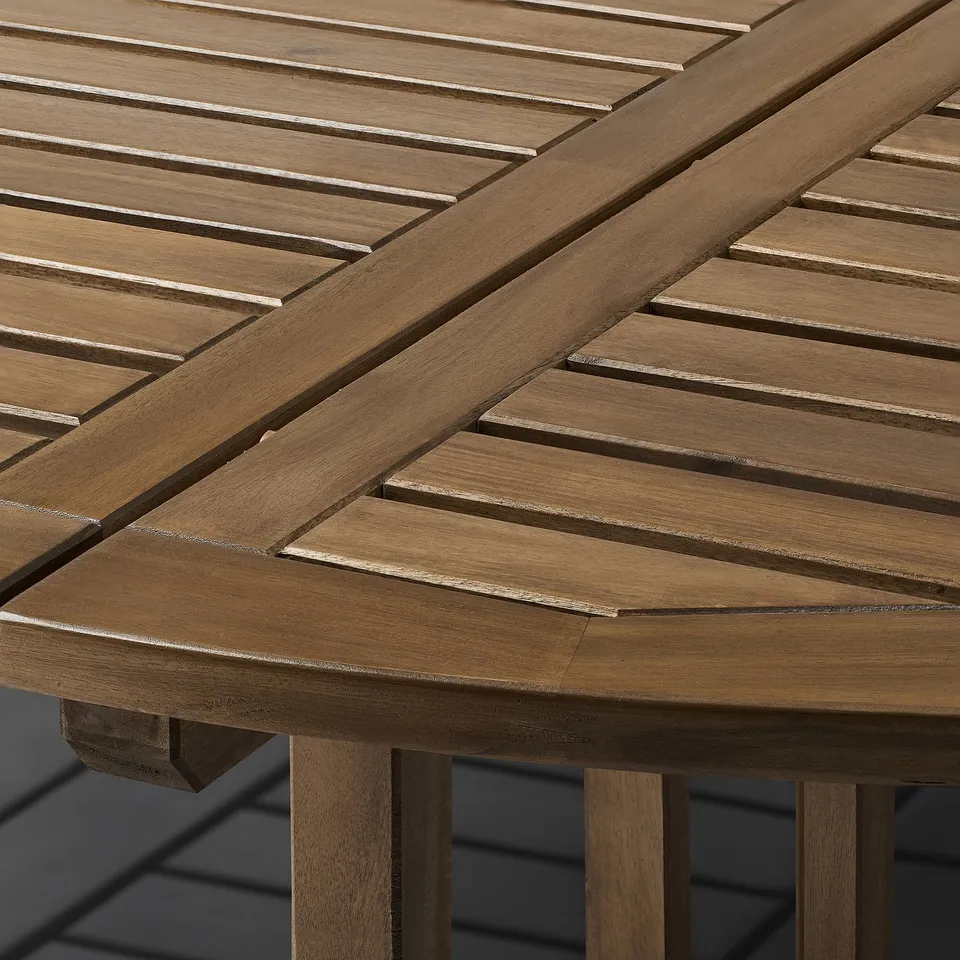 Close-up of NÄMMARÖ tables sleek, slatted acacia wood surface, showcasing its smooth, durable finish and elegant design.