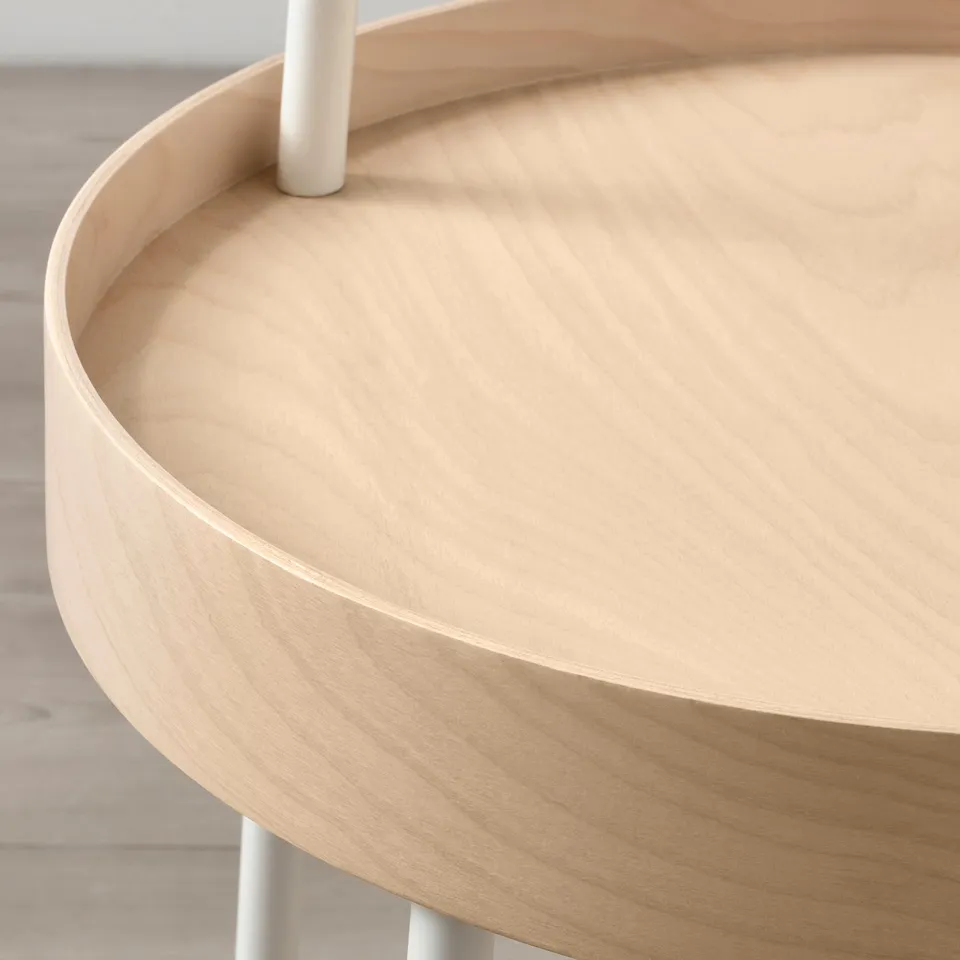 Modern round side table with smooth, light wooden top and sleek white handle, perfect for carrying.