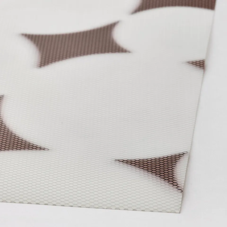 Close-up of VÅRKLYNNE place mats. Textured, recycled polyester surface with distinct wave pattern. Edges show tear resistance, indicating durability.
