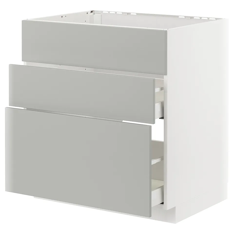 Modern white kitchen cabinet with light grey drawers, rectangular, minimalist design.
