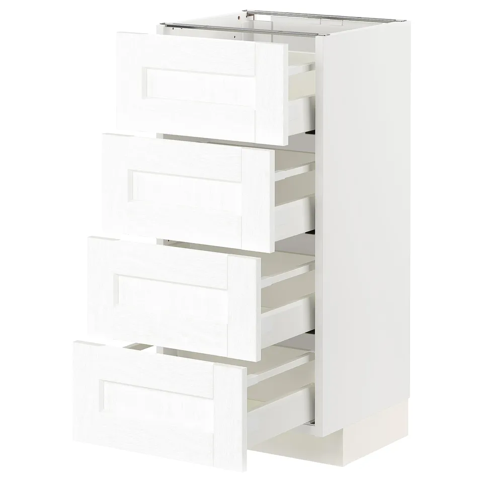 White METOD kitchen unit with four open drawers.