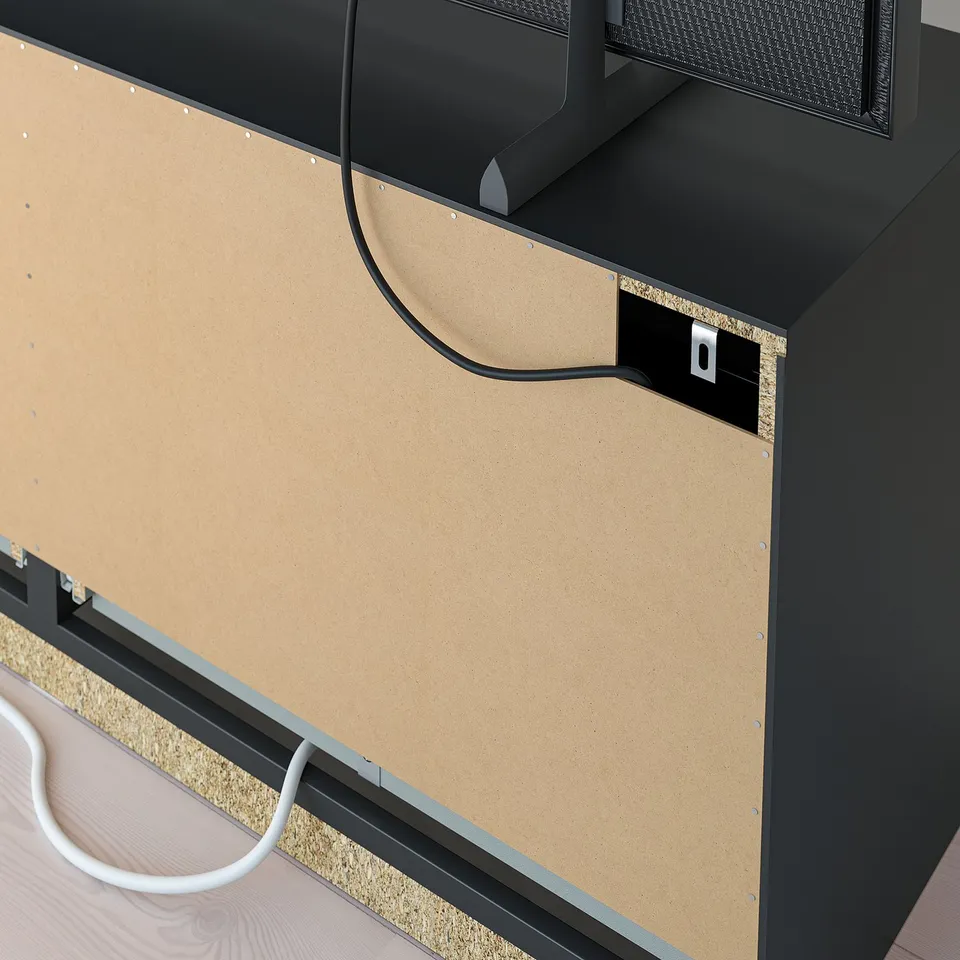 Black tv stand with adjustable shelves and cable outlets, wire neatly through back.