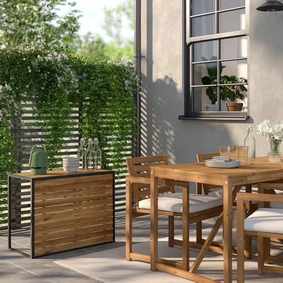 Small modern HÅKANSKÄR table, wood, and metal, used as a high table, near large window, signed by greenery.