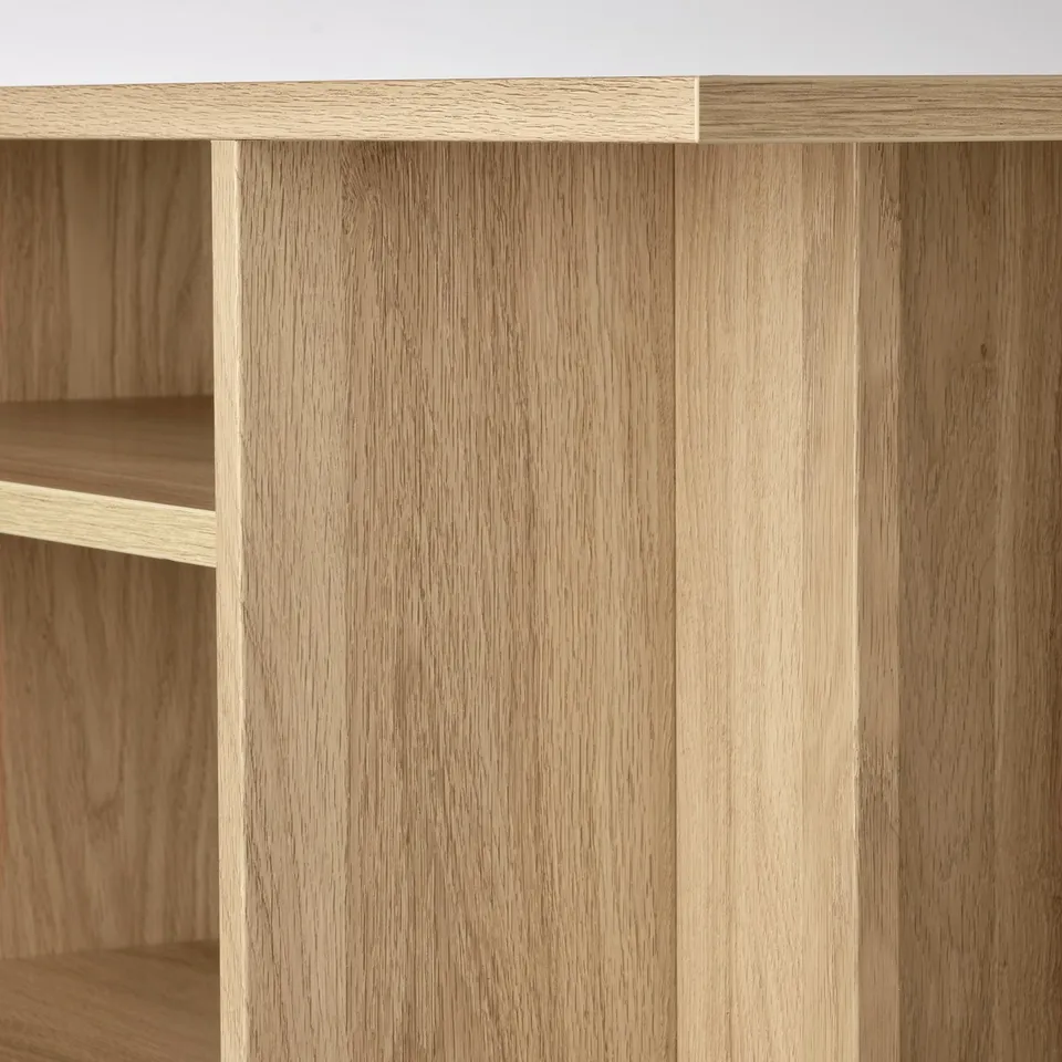 Modern wooden side table with sleek design and natural finish, featuring open storage shelves.