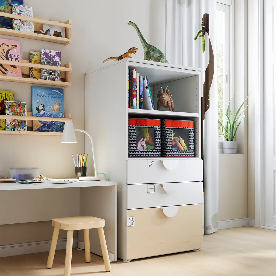 Childrens room with white SMÅSTAD bookcase, wooden toys, and desk.