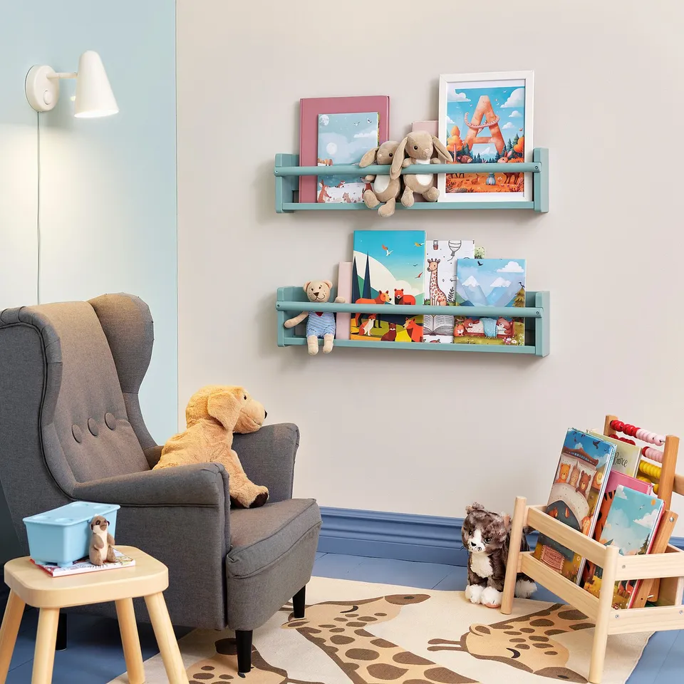 Child-friendly wall shelves with books and toys. Perfect for a kids reading corner next to a cosy armchair.