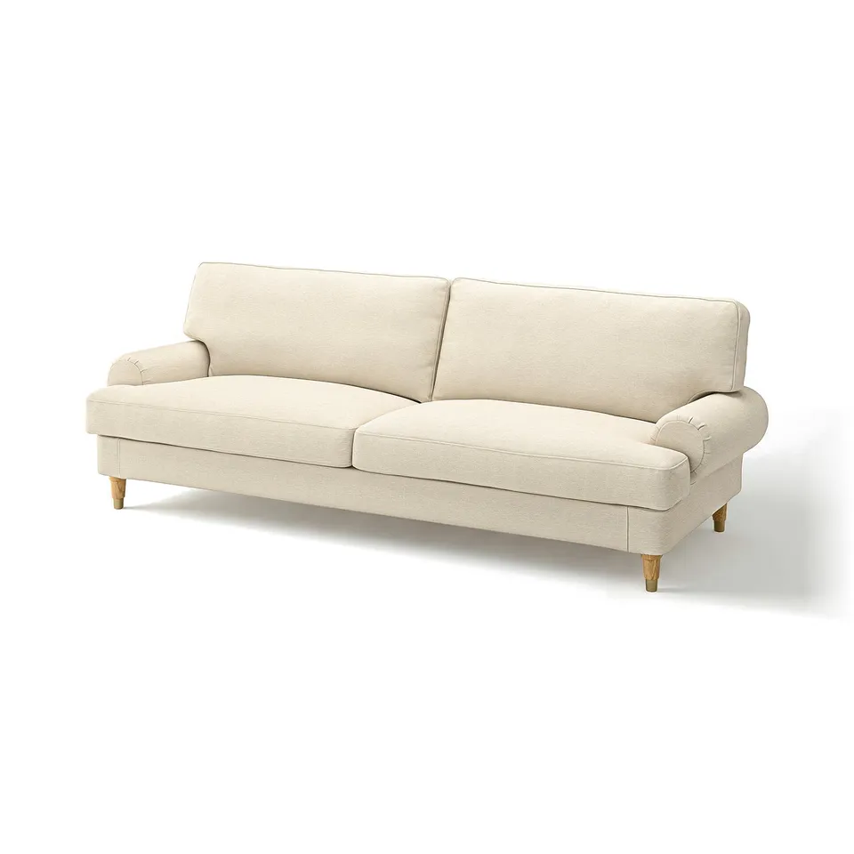 A beige VALNÄS sofa with rolled arms and wooden legs, crafted from 76% cotton and 24% polyester, exuding a contemporary classic design.