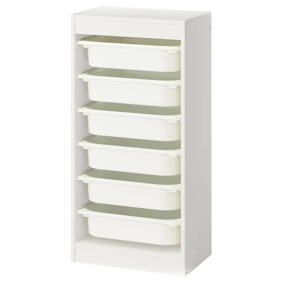 A white TROFAST storage unit with six green-rimmed, removable plastic boxes, designed for children.