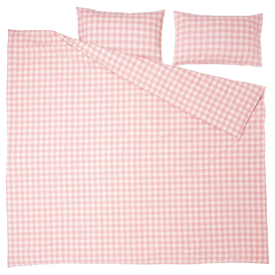 A light pink and white gingham check bedding set made of organic cotton. Includes a duvet cover, flat sheet, and two pillowcases.