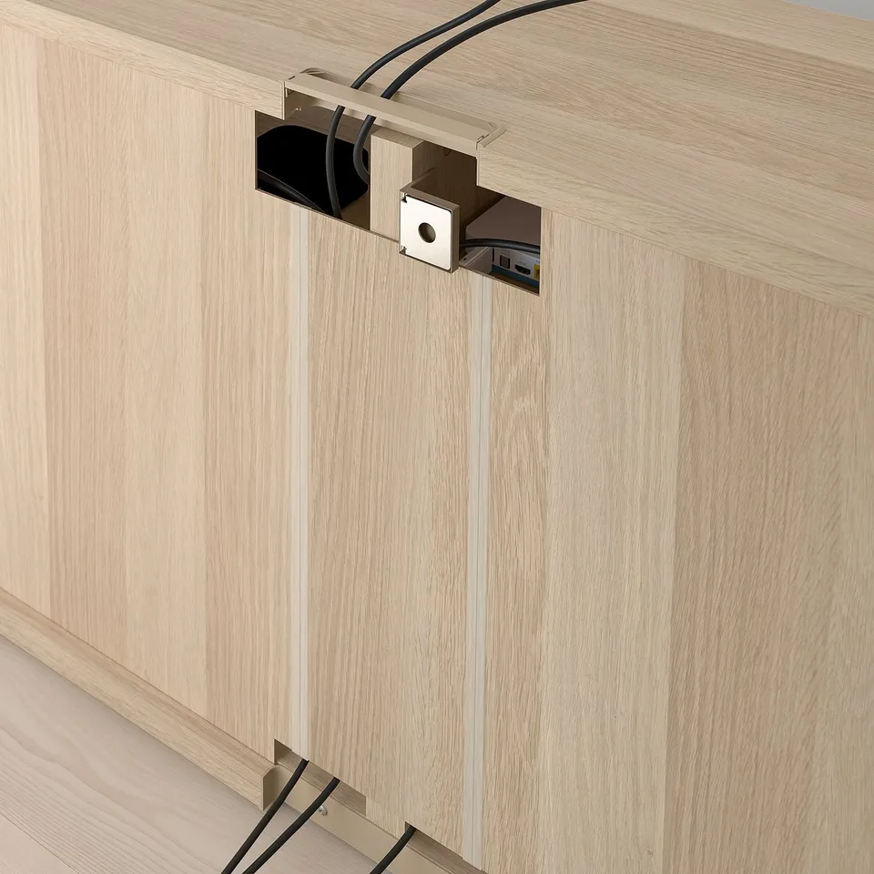 Wooden tv bench with integrated cable management, showcasing adjustable shelves and cable outlets at the back.
