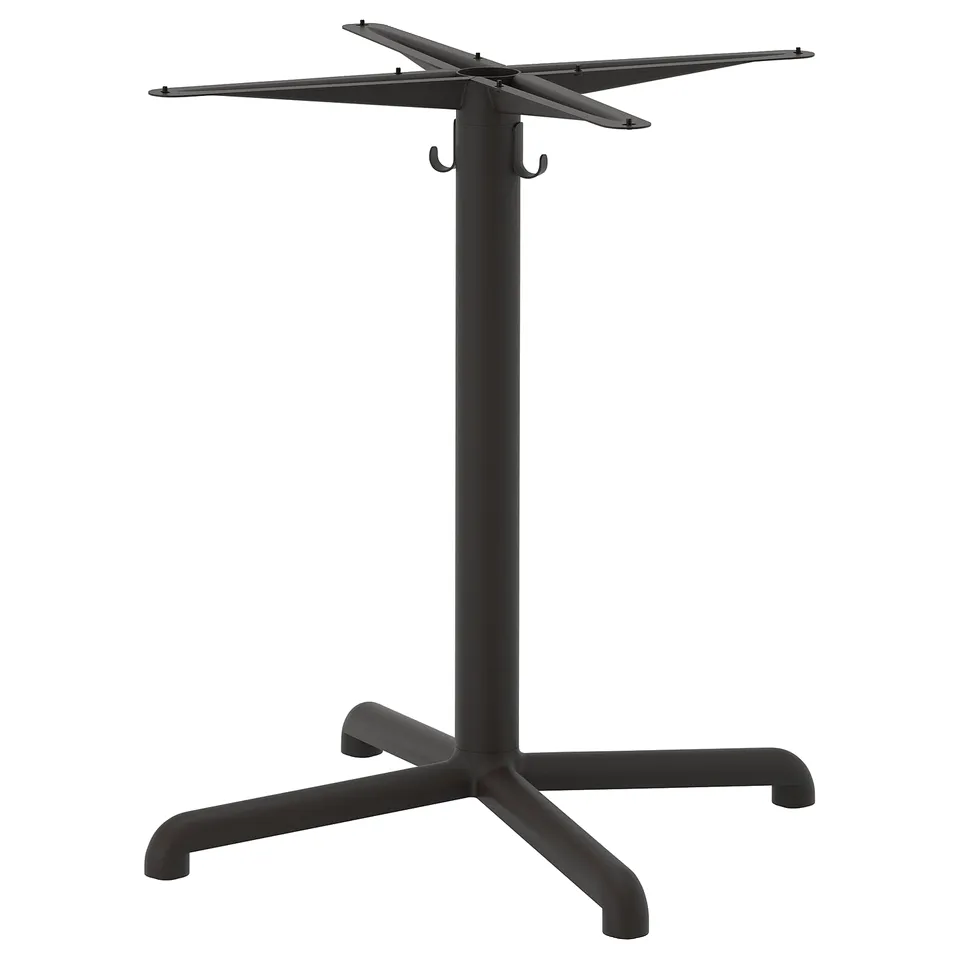A STENSELE black table base with a star-shaped top, made of aluminium and steel.