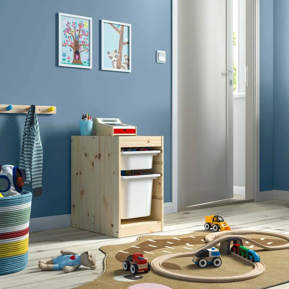 Kids playroom with TROFAST light wood storage, colourful rug, and toys.