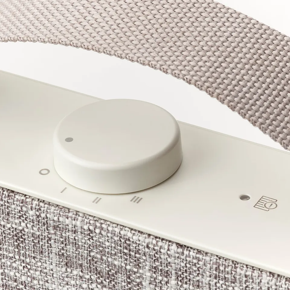 Modern air purifier control panel with textured fabric design.