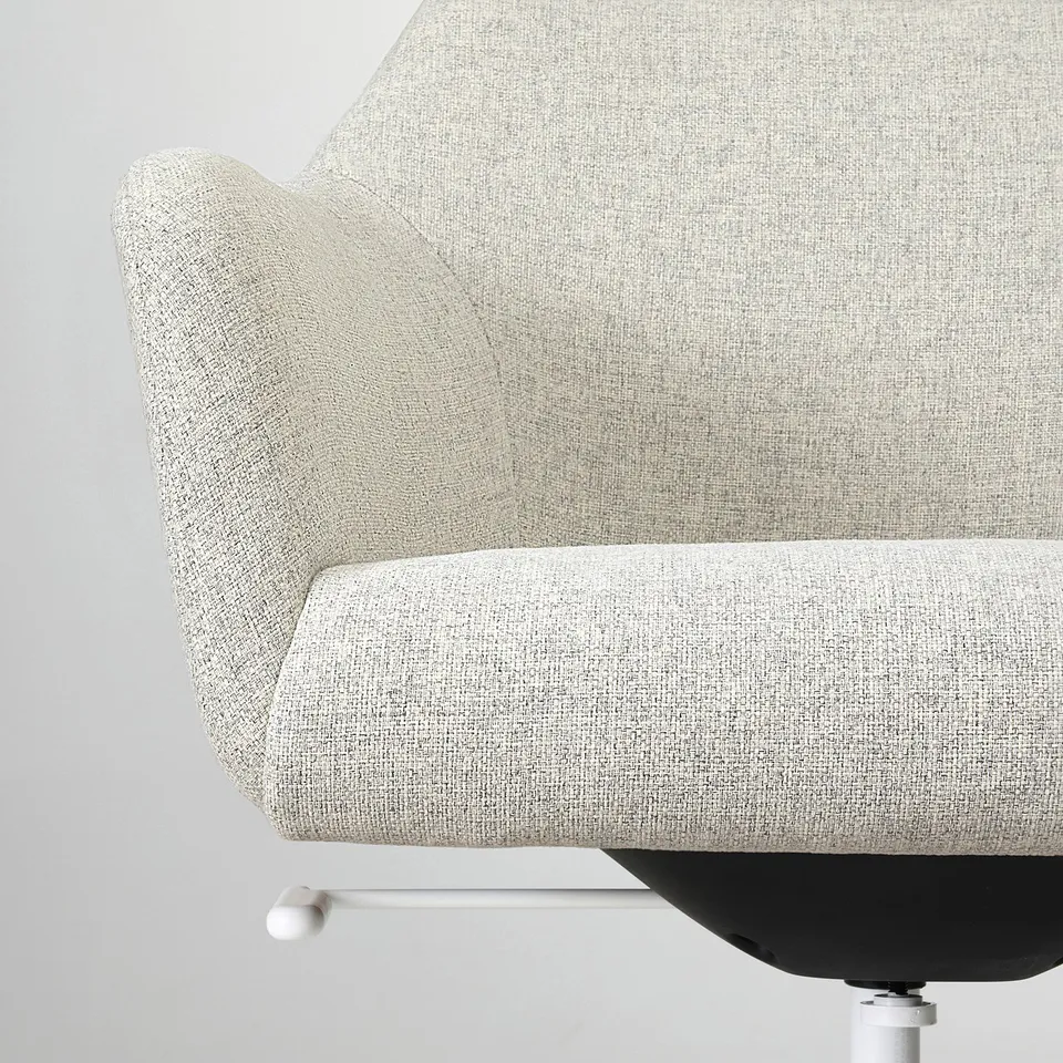 Modern office chair with soft padding. High backrest for support, upholstered in durable fabric. Comfortable and ergonomic design.