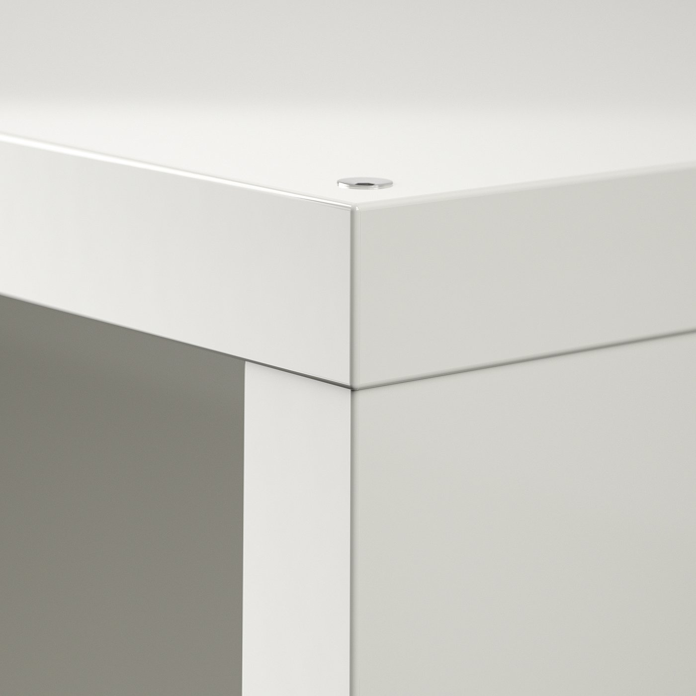 Clean white cabinet corner; smooth finish, precision edges; modern design.