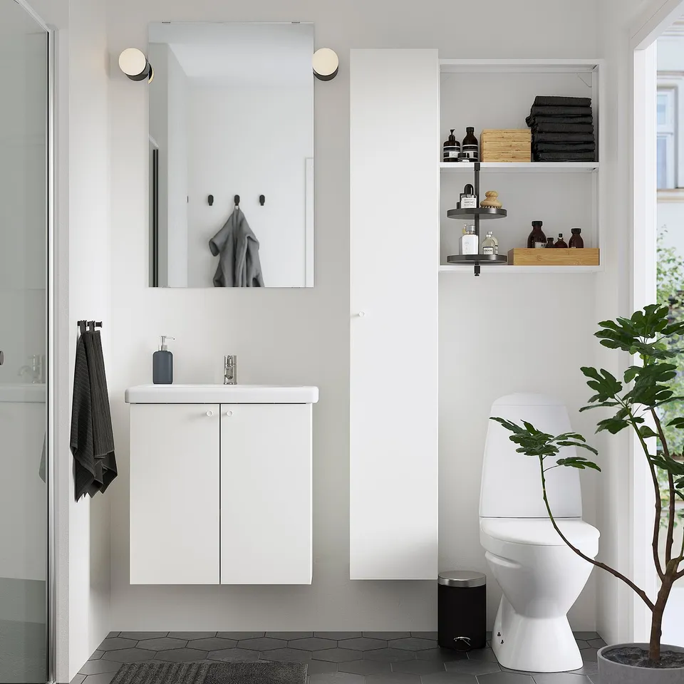 Modern bathroom: ENHET cabinet, sink, mirror, diffuser. Black accents & plant.