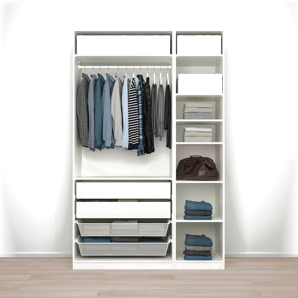 A modern white wardrobe with a hanger rod for shirts and drawers below for folded clothes.