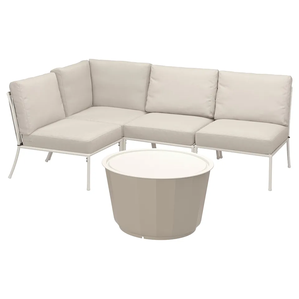 Modern outdoor furniture set. Cream-colored cushions and white metal frames. Includes corner sofa, chairs, and coffee table.