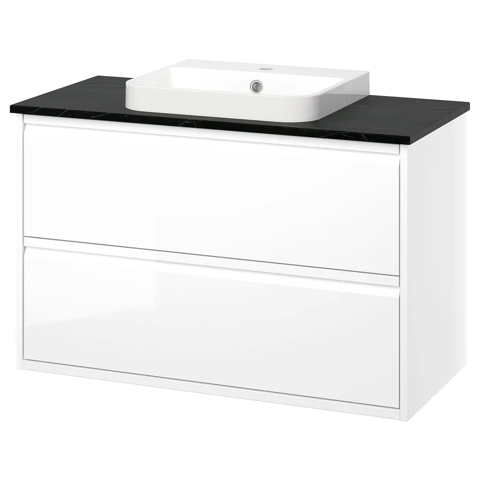 A modern white ÄNGSJÖN bathroom cabinet with sleek, minimalist design, including a semi-recessed marble sink and black countertop.