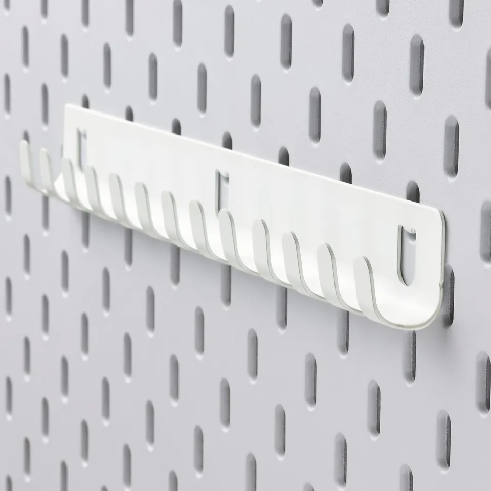 SKÅDIS organiser on pegboard, durable white steel hooks, neatly arranged, easy access.