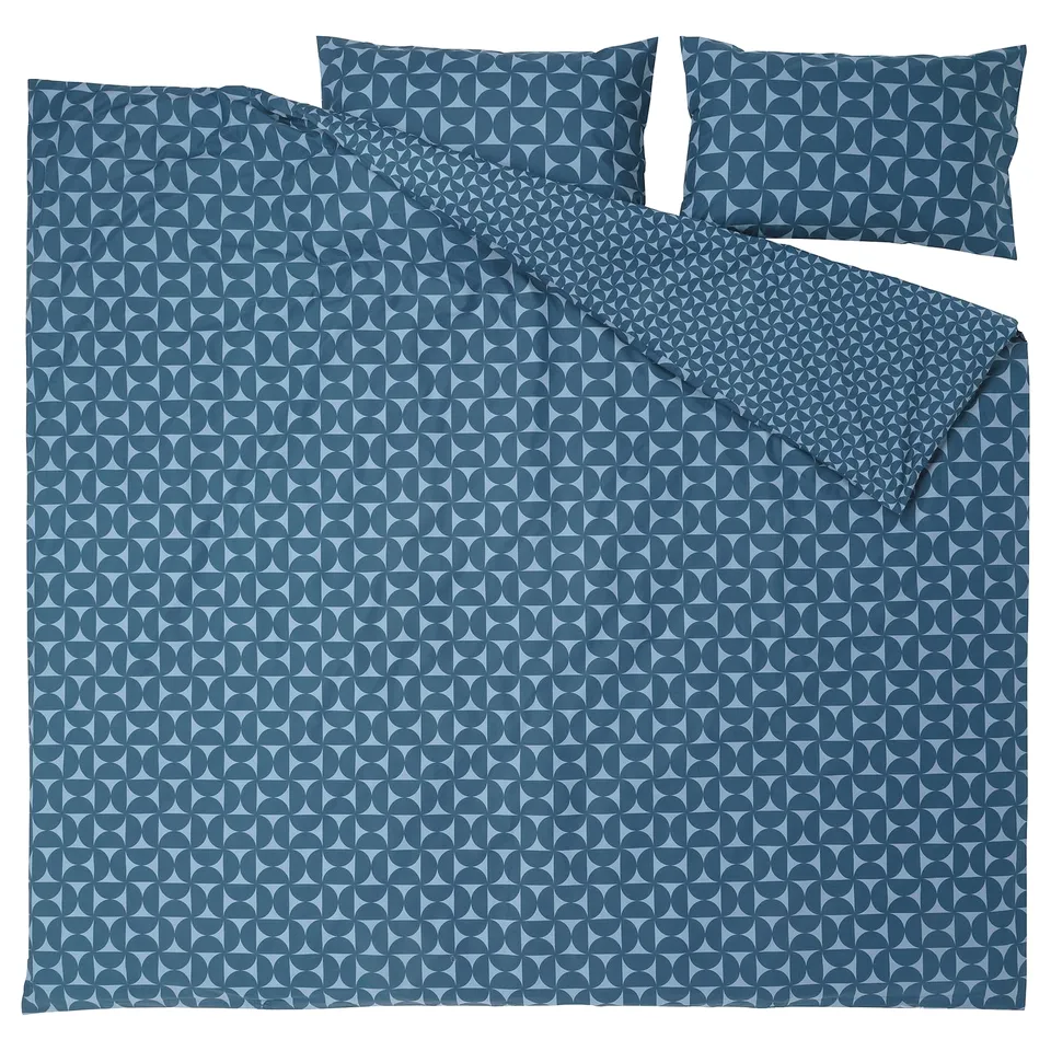 Blue geometric bedding set with matching pillowcases.