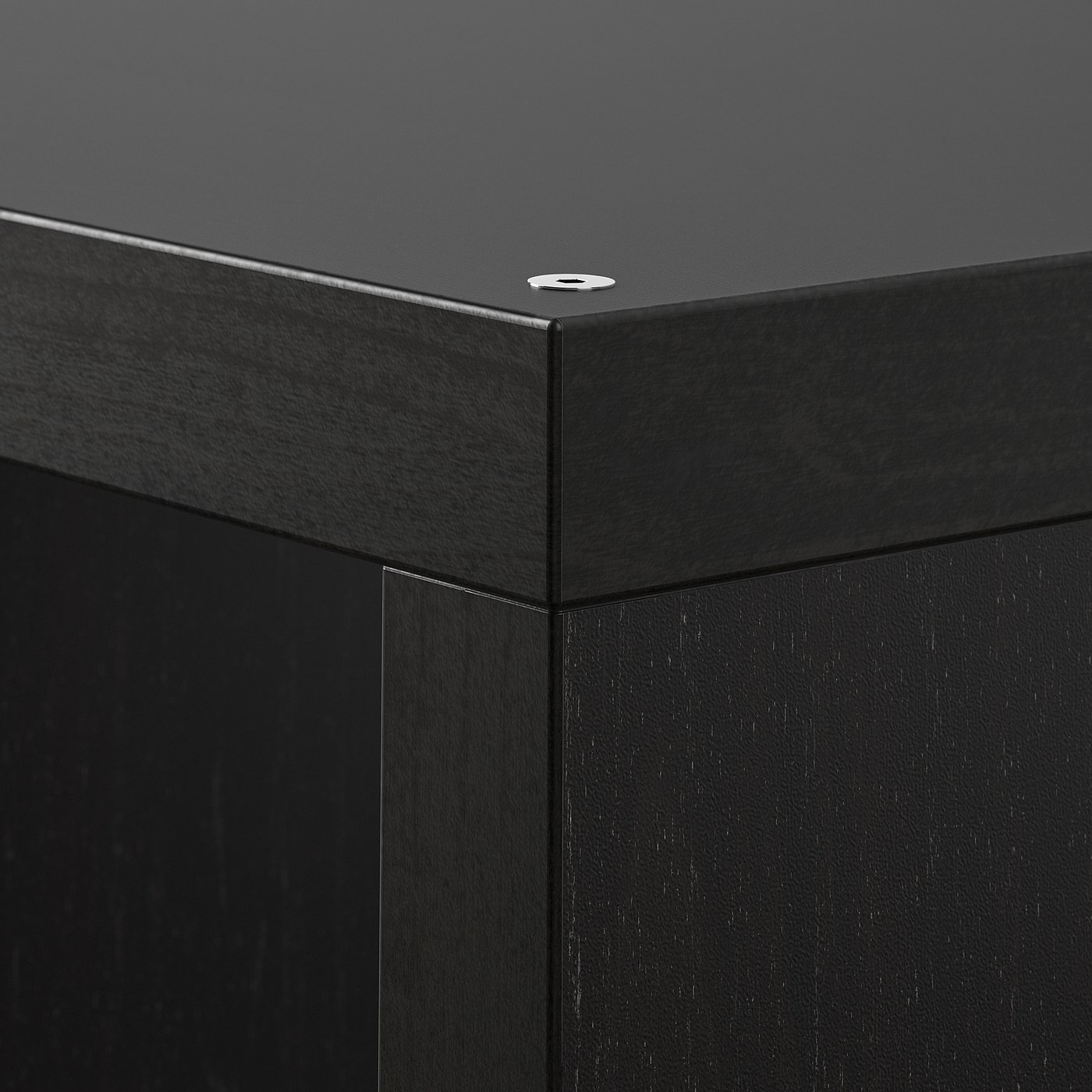 Black shelving unit corner with sleek metal edge detail. Solid, modern design.