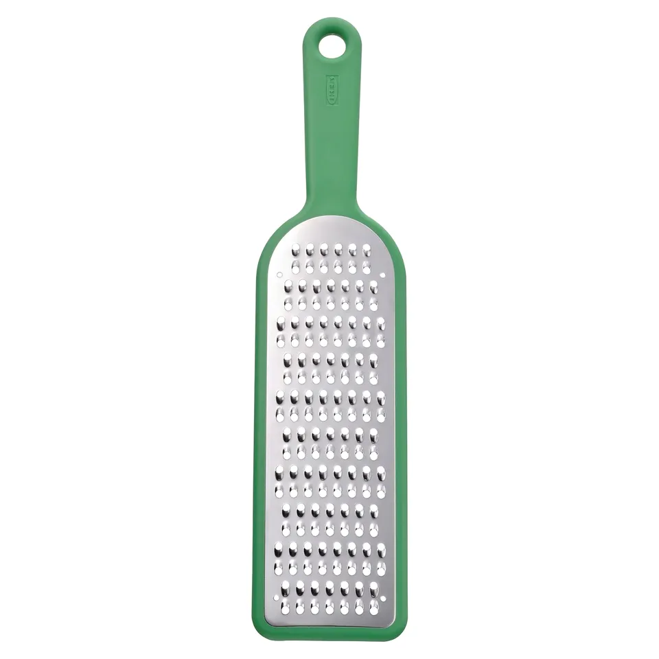 Green UPPFYLLD kitchen grater with stainless steel grating surface, green plastic handle, rectangular shape, with hanging hole.