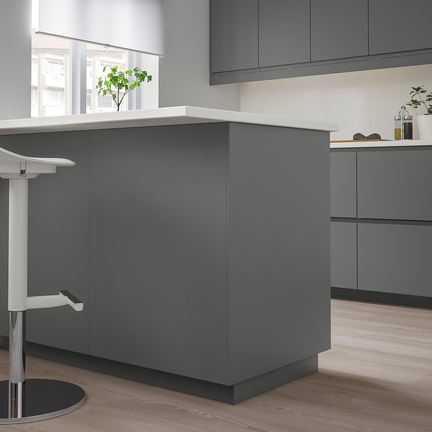 Modern grey FÖRBÄTTRA kitchen island. Sleek cabinets with glossy finish, slim countertop. Tall, rectangular design, larger than stool.