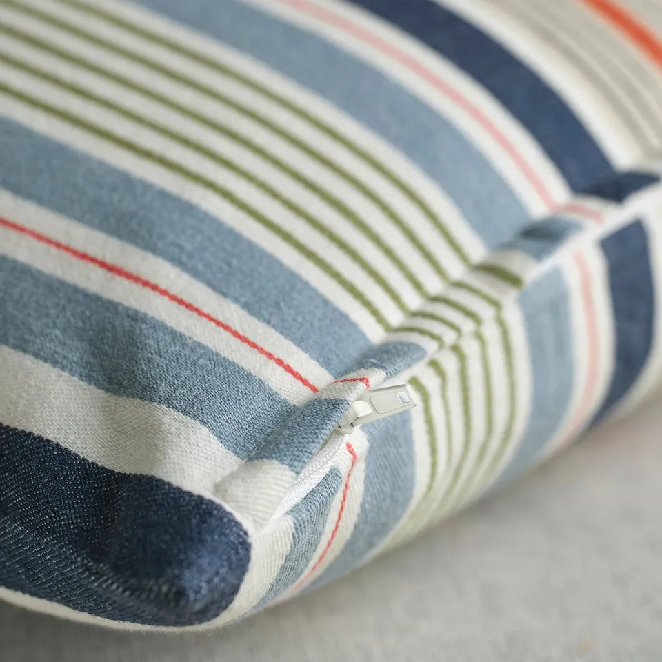 Striped cushion cover with zip, blue, green, red stripes, soft yet textured fabric.