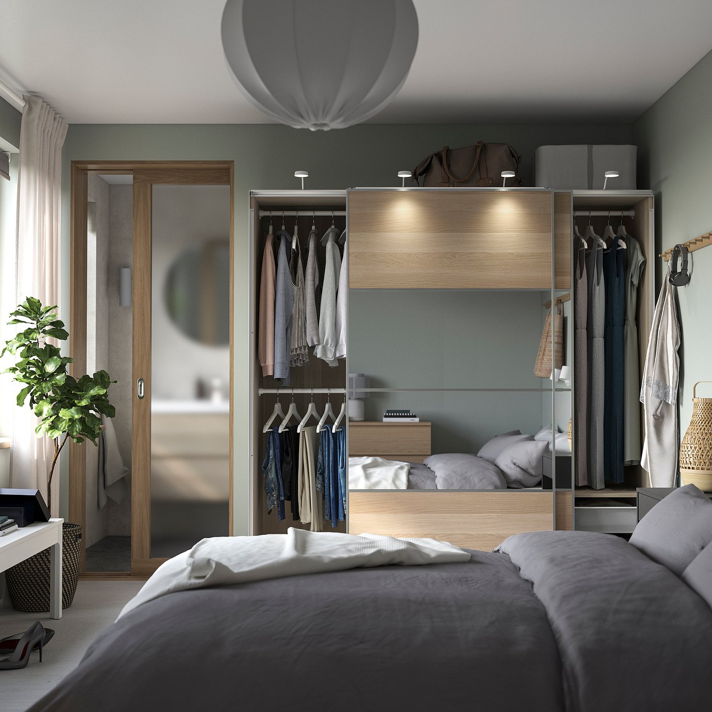 Modern bedroom with grey bedding, open wardrobe displaying clothes, sliding mirror doors, and hanging plants.