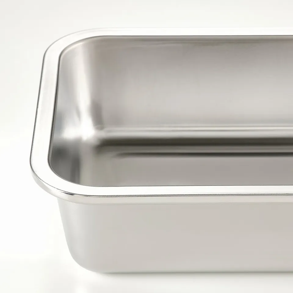 Stainless steel oven-safe food container shown, sleek, reflective surface, durable and polished.