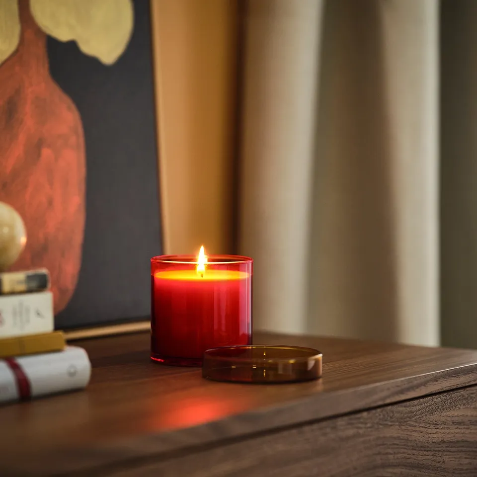 DVÄRGHÖK Scented candle in glass with lid, Citrus flower red-orange/yellow-brown, 50 hr