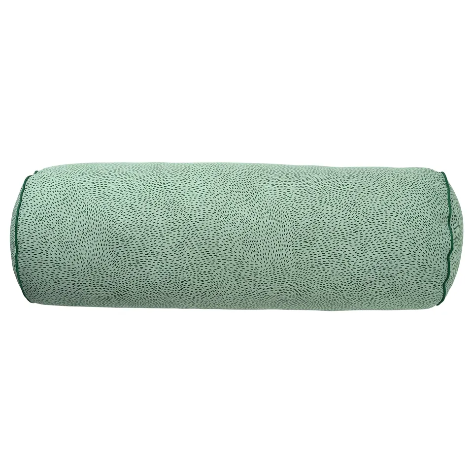 Cylindrical green patterned pillow with recycled materials.