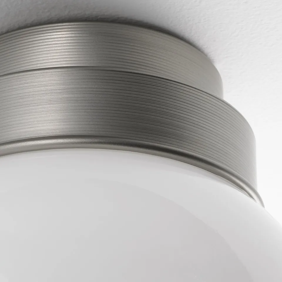Metal ceiling lamp with glass shade, showcasing modern design, perfect for bathrooms.