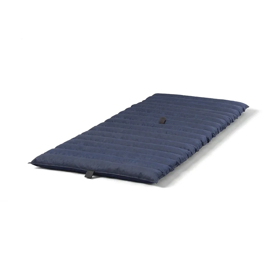 A navy blue JESSHEIM futon mattress, rectangular, with foam filling, laid flat.