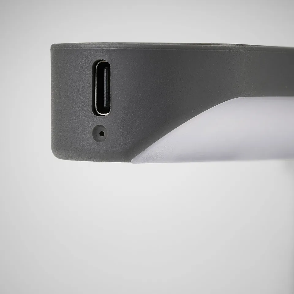A sleek, modern usb-c charging port on a rechargeable, slim light device.
