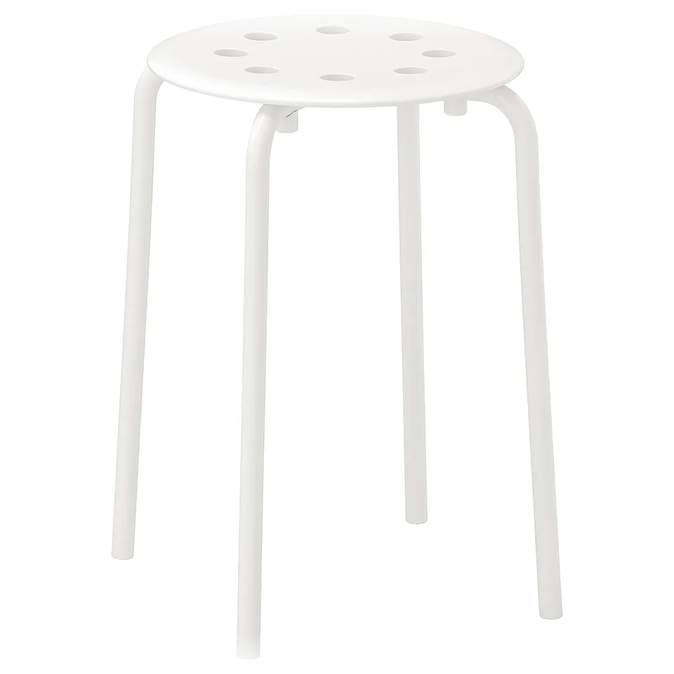 A white MARIUS stool, round, with metal legs and a perforated seat.